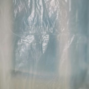 Roll of self-adhesive carpet protection film